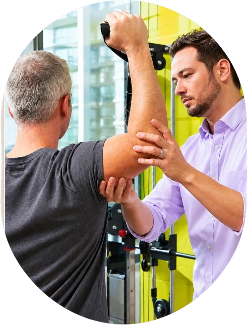 Physiotherapist guiding a patient through a shoulder movement assessment